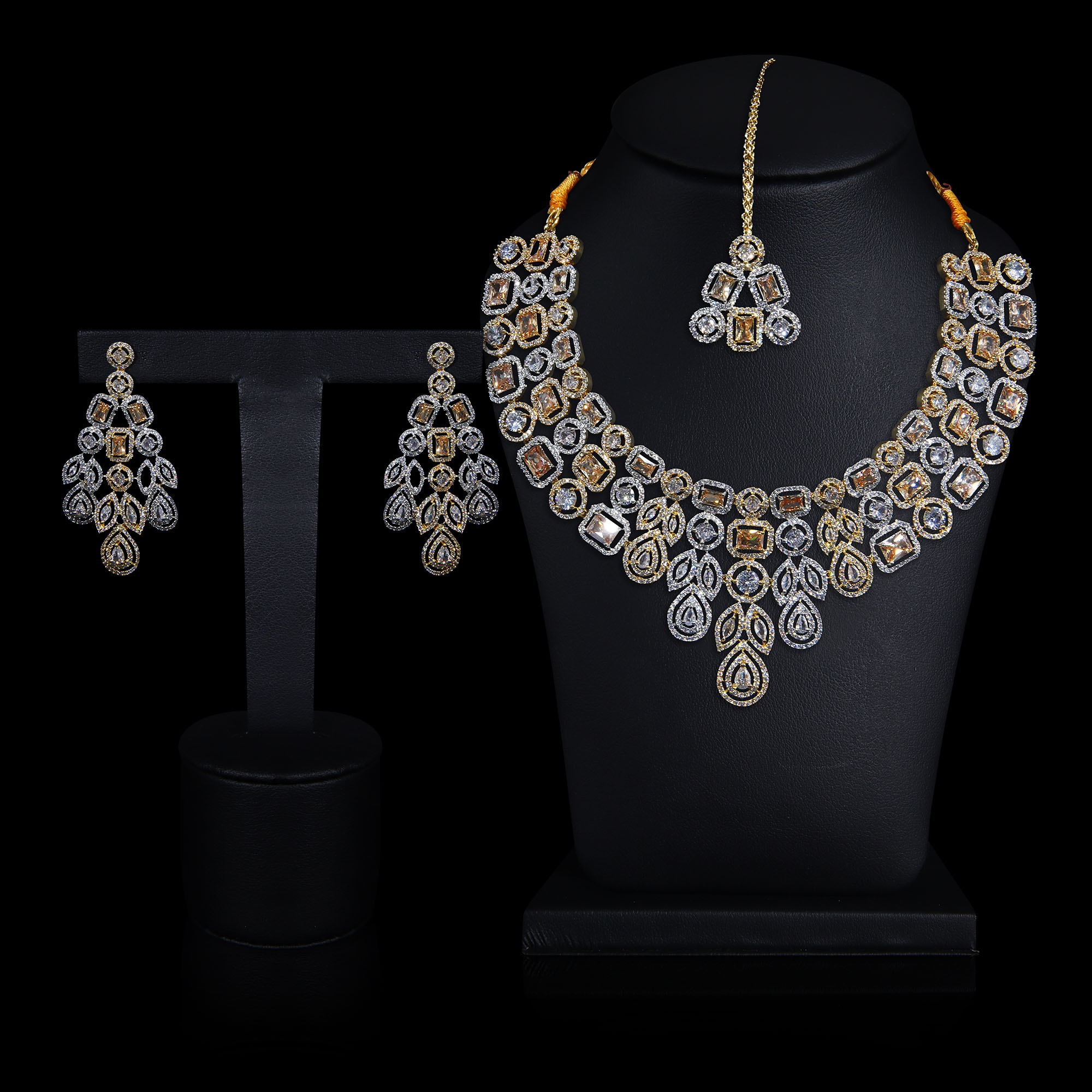 A diamond necklace and dimaond earring display on dummy