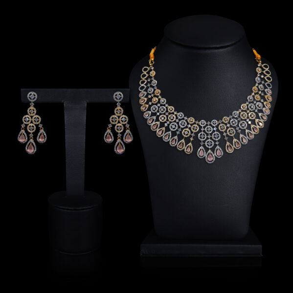 A diamond necklace and dimaond earring display on dummy