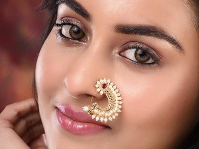 A bridal wear polki nose ring in their nose