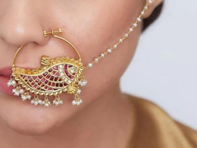 A bridal wear stud-with-an-attached-chain​ nose ring